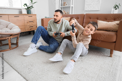 Happy father and his son pl...