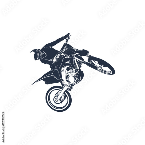 Silhouette of a motocross rider performing a wheelie.