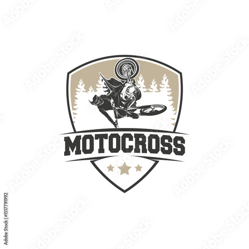 Motocross rider in mid-air, performing a jump.