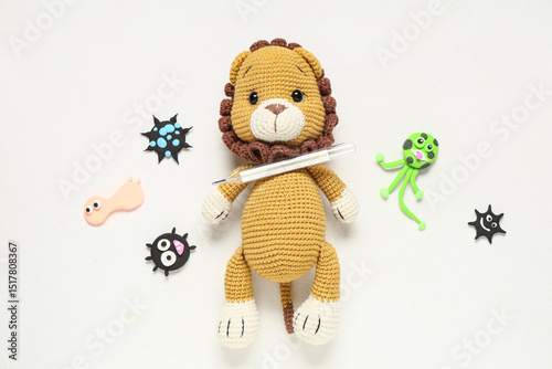 Toy lion with thermometer a...