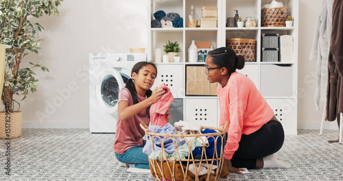 The daughter helps mother with household chores, the women sort laundry, fold clothes, prepare them for drying, they spend time together in the bathroom talking smiling