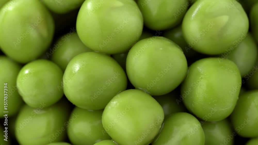 Fresh green peas background, texture of perfect peeled sweet pea grains as background. Vegetable background, vegetable protein, healthy products. Canned peas. spinning in a circle Fresh green peas background, texture of perfect peeled sweet pea grains as background. Vegetable background, vegetable protein, healthy products. Canned peas. spinning in a circle