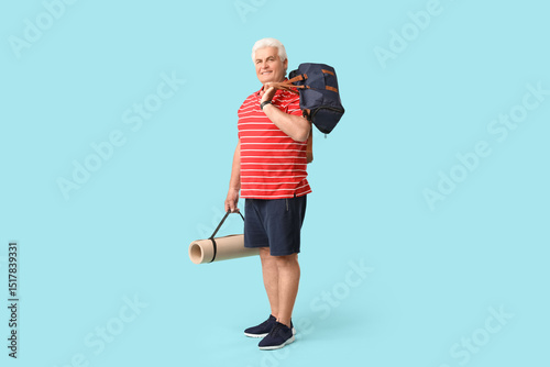 Senior man with sports bag ...