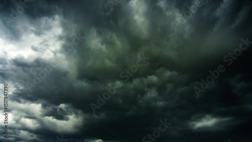 Dramatic dark storm clouds gathering in the sky, creating a moody and intense atmosphere