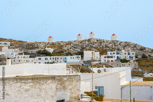 Fototapeta Naklejka Na Ścianę i Meble -  Windmills on a hill in the village of Chora on the island of Amorgos. Cyclades, Greece