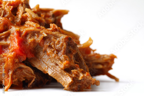 Slow-cooked shredded beef with rich spices, evoking Dia de los Muertos feasts and rustic culinary heritage, savory indulgence awaits