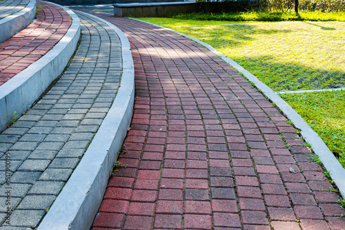 Curved staircase made of paving blocks in the city park area
