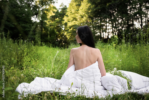 the girl woke up in the forest on a white bed