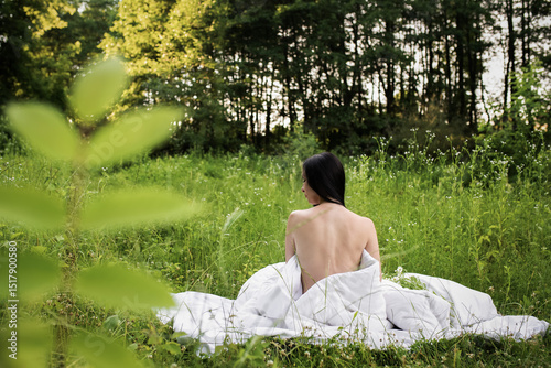 the girl woke up in the forest on a white bed