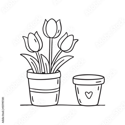 A cluster of tulips beside a small pot