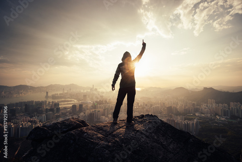Canvas Print Successful woman hiker on the mountain top cliff edge in Hong Kong