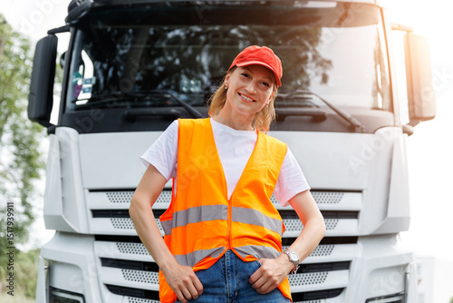 Wallpaper Mural Portrait young adult happy smiling woman heavy truck driver modern cargo vehicle cabin background. Female person girl professional job career working driving freight engine lorry. Logistics industry Torontodigital.ca