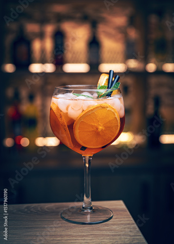 Orange cocktail with ice and mint