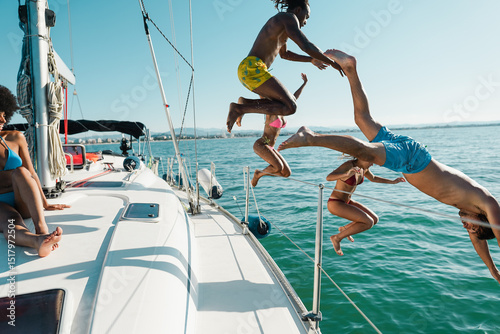 Cuadro en lienzo Happy multiracial friends jumping inside the ocean during summer vacation - Holi