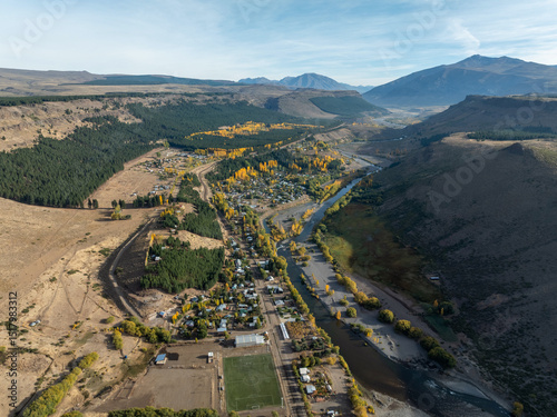 Aerial view of Manzano Amargo village with autumnal colors and Neuquen winding river among hills and mountains. Neuquen province, Argentina photo