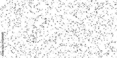 A textured grayscale abstract image presenting a random pattern of fragmented elements resembling granite chips.