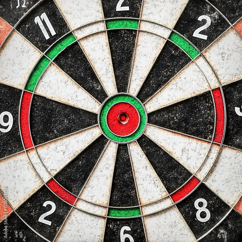 Close up image of a classic dartboard with target bullseye aiming for accuracy and competition