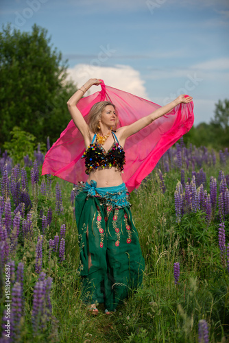 B dancer performing in a vibrant lavender field under a blue sky