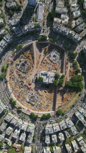 Vertical video drop down rotation over Kikar (square ) Hamedina impressive project construction - tel aviv, israel photo