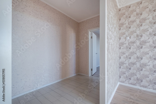 long empty corridor in interior of entrance hall without furniture of modern apartments, office or clinic