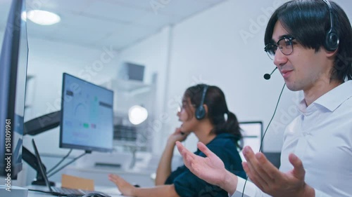 Customer care support at Call center office. Confident Diverse Customer Service Operators Wearing headset Working on Computer talking to client for telemarketing, CRM and helpdesk support in office.