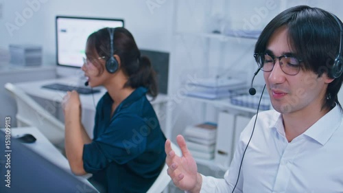 Customer care support at Call center office. Confident Diverse Customer Service Operators Wearing headset Working on Computer talking to client for telemarketing, CRM and helpdesk support in office.
