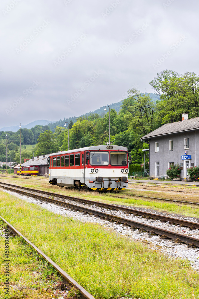 Naklejka premium Diesel railcar standing at Tisovec train station in Slovakia