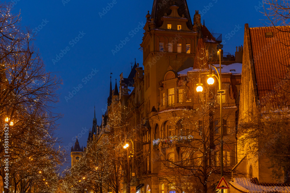 Fototapeta premium Christmas lights illuminating prague street Parizska at twilight