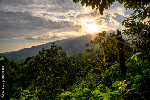 Sunset over mountain with tropical rain forest