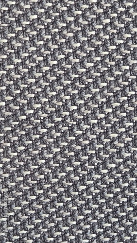 Close-up of gray woven textile fabric texture, seamless background pattern, detailed upholstery cloth material, abstract textile design, modern interior decor, high-resolution graphic resource