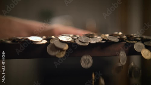 This is a CloseUp of Various Coins Artfully Arranged on a Textured Wooden Surface