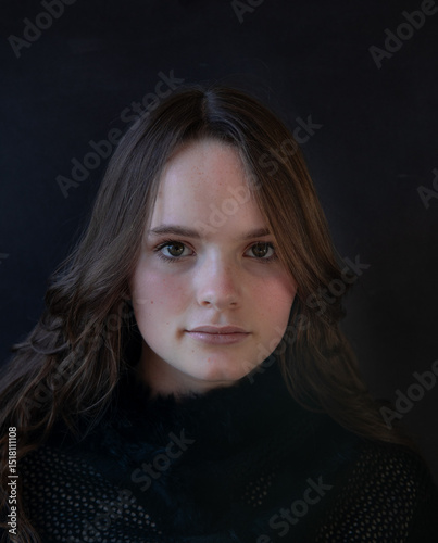 Portrait of a teenage girl wearing black
