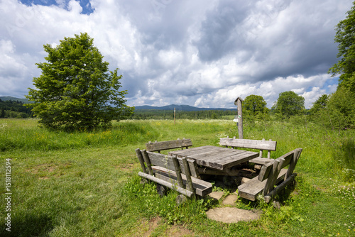 Fototapeta Naklejka Na Ścianę i Meble -  Wooden table and benches inviting hikers to rest in the Bieszczady Mountains, Poland