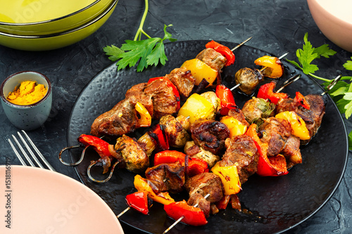 Skewers with grilled meat and vegetables.