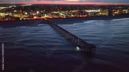 Aerial view of the Jacksonville Beach Pier in north Florida at dusk.