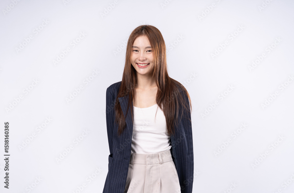 Beautiful Asian businesswoman with brown hair dressed in modern suit standing smiling face portrait in studio white background Beautiful Asian businesswoman with brown hair dressed in modern suit standing smiling face portrait in studio white background