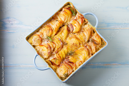 Tender creamy potato gratin. Scalloped potatoes or potato bake. High angle view