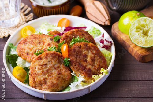 Fish cakes with vegetables and mashed potatoes. Fish patties or burgers