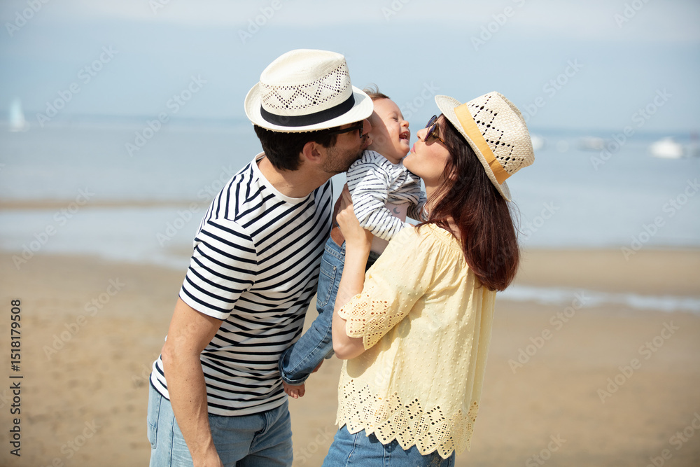 happy man woman and baby on the beach happy man woman and baby on the beach