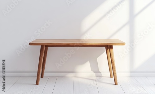 Simple wooden table against a white wall