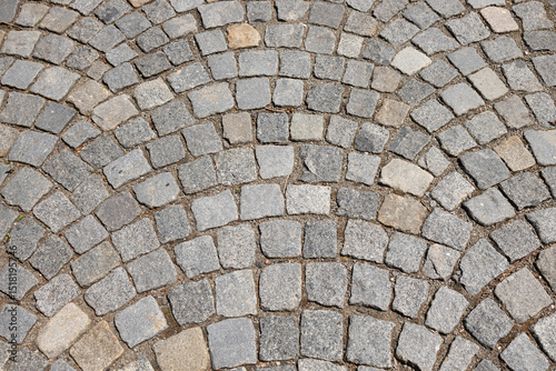Old stone pavement with irregular granite blocks
