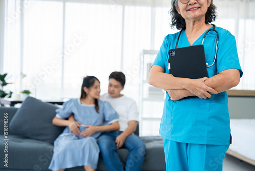 A caring gynecologist provides expert guidance and health care during a pregnancy examination. With ultrasound technology, the doctor offers advice to ensure the well-being of both and her family