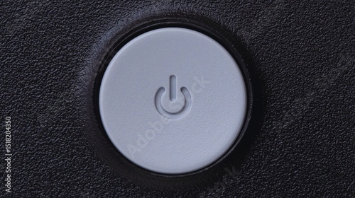 Close-up of a power button, a symbol for starting or stopping technology, on a clean white or black background