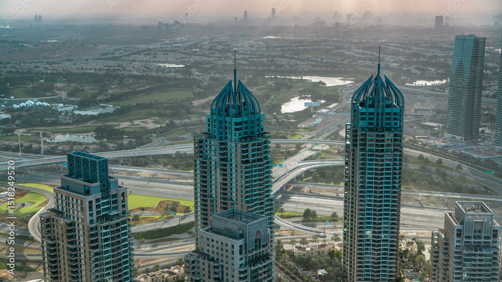 Obraz premium Morning in Dubai Marina with towers and traffic on road from skyscraper, Dubai, UAE timelapse