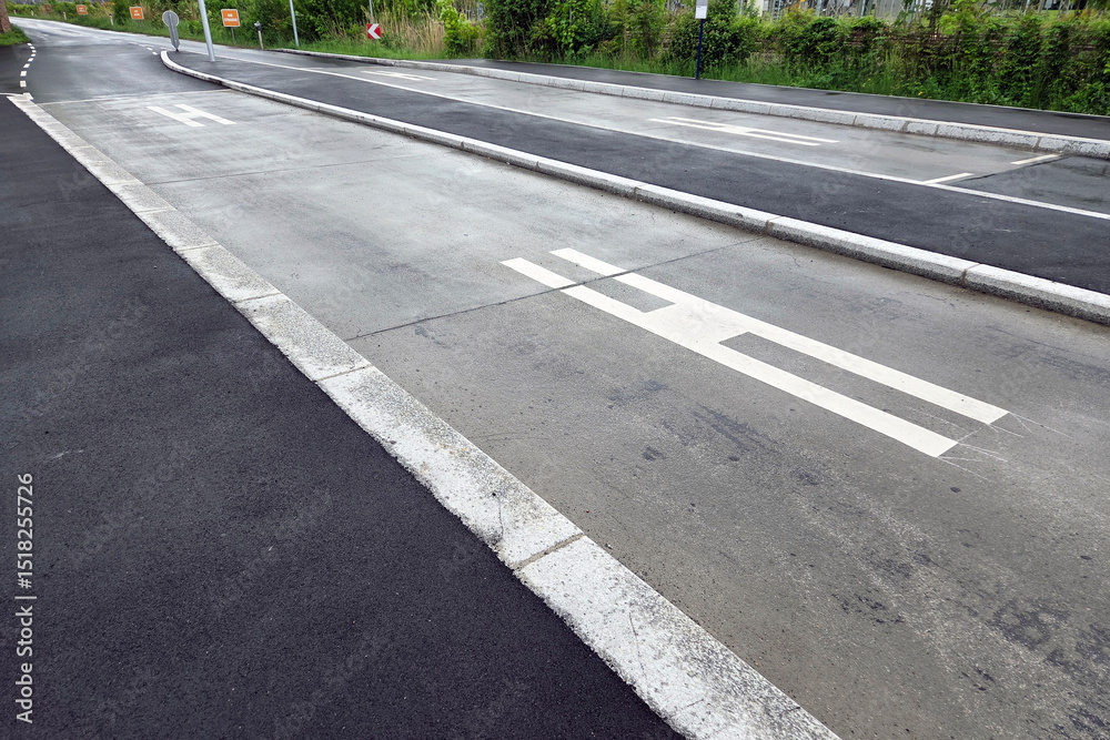 Obraz premium Urban Road Infrastructure with Bus Lane and Pedestrian Symbols for Traffic Management