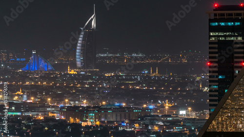 Aerial view of a big modern city at night timelapse. Business bay, Dubai, United Arab Emirates.
