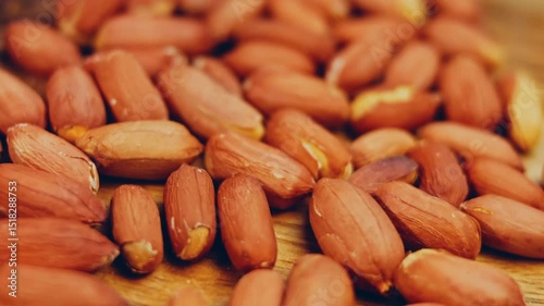 Waviness effect of Peanuts with bark on a retro tray. Peanuts cleaned in the background. Slider shooting