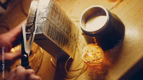 Waviness effect of The woman cuts the coffee pack with scissors. Coffee brewing process in the coffee maker. Romantic ambiance and macro filming with the slider