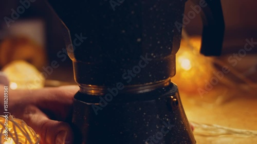 Waviness effect of Assembling coffee machine parts. Coffee brewing process in the coffee maker. Romantic ambiance and macro filming with the slider
