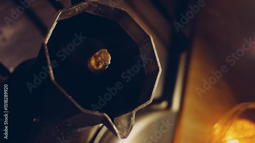 Waviness effect of Boil the coffee in the coffee maker and make steam and condensate strobes. Coffee brewing process in the coffee maker. Romantic ambiance and macro filming with the slider